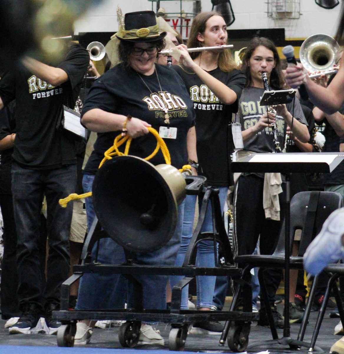 Stacie Martin rings the victory bell during the pep rally before the last Rider-Old High football game. 